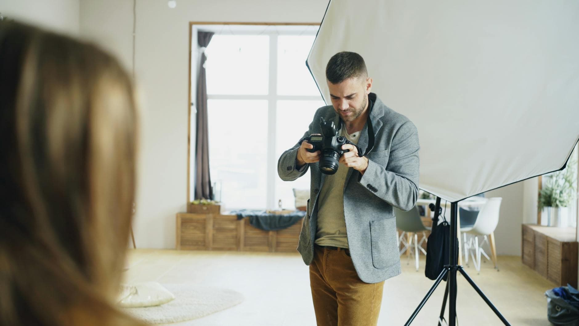 Photographer shooting a portrait in a studio